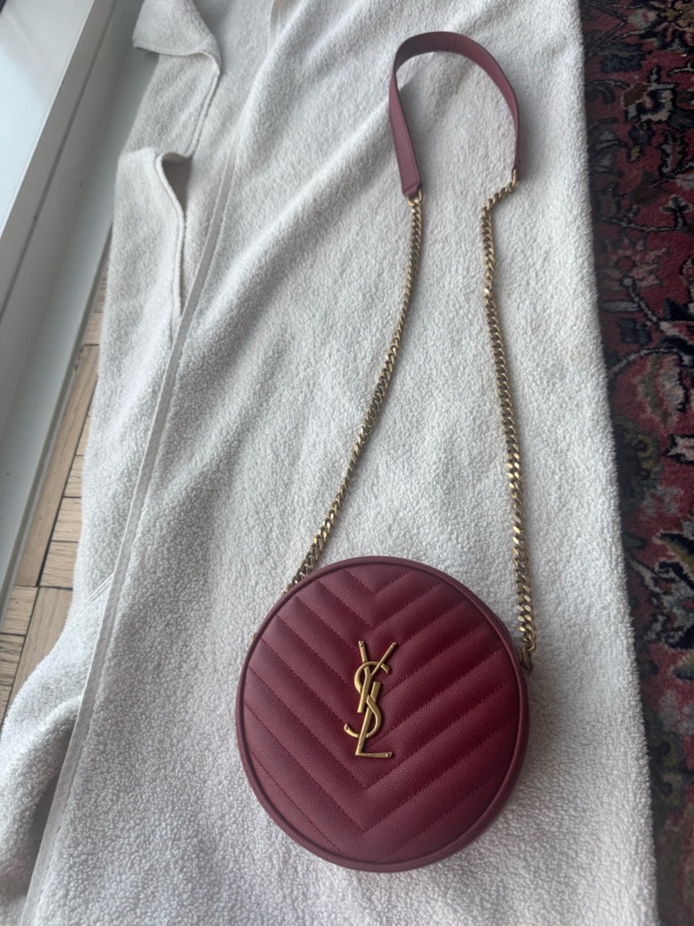 Yves Saint Laurent Round Quilted Crossbody in Wine with Gold Hardware